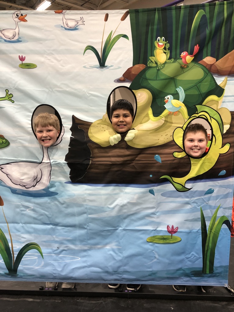 3 students peeking through water animal faces