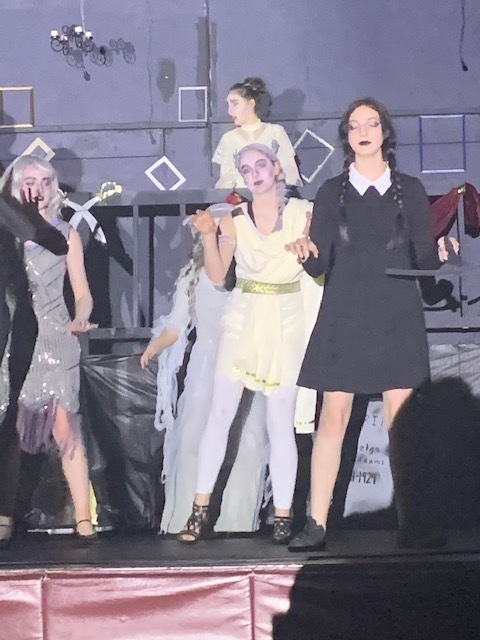 Students on stage in costume.