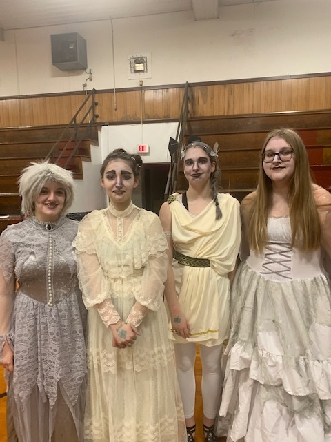 Four students in costume.