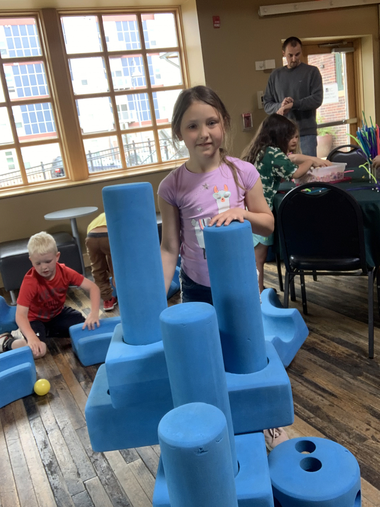 Girls with blue clay structures