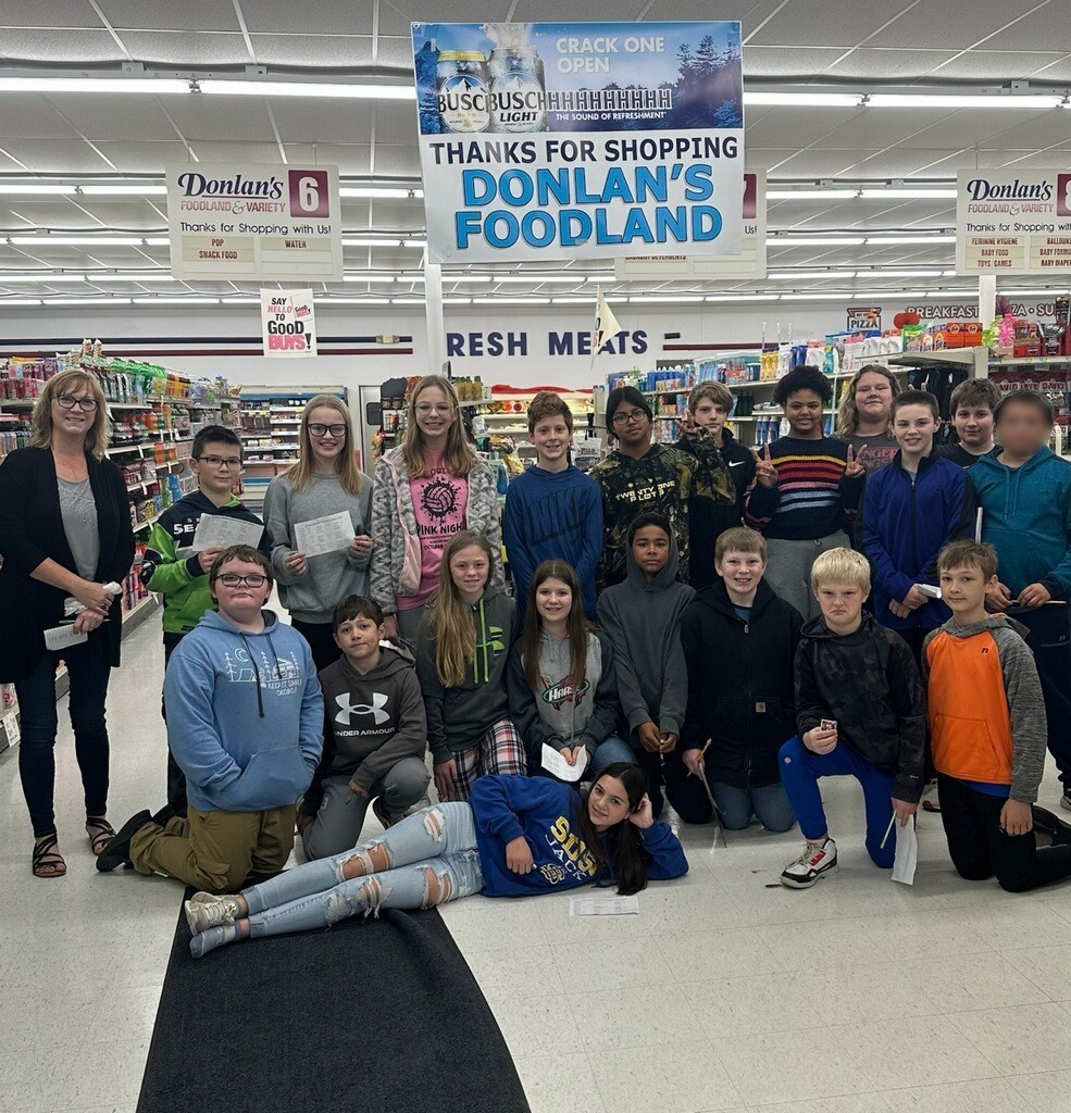 20 students and teacher in grocery store