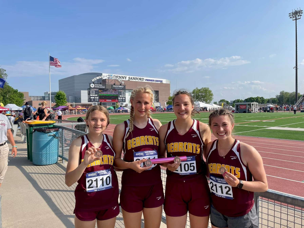 4 girls at state track meet showing medals