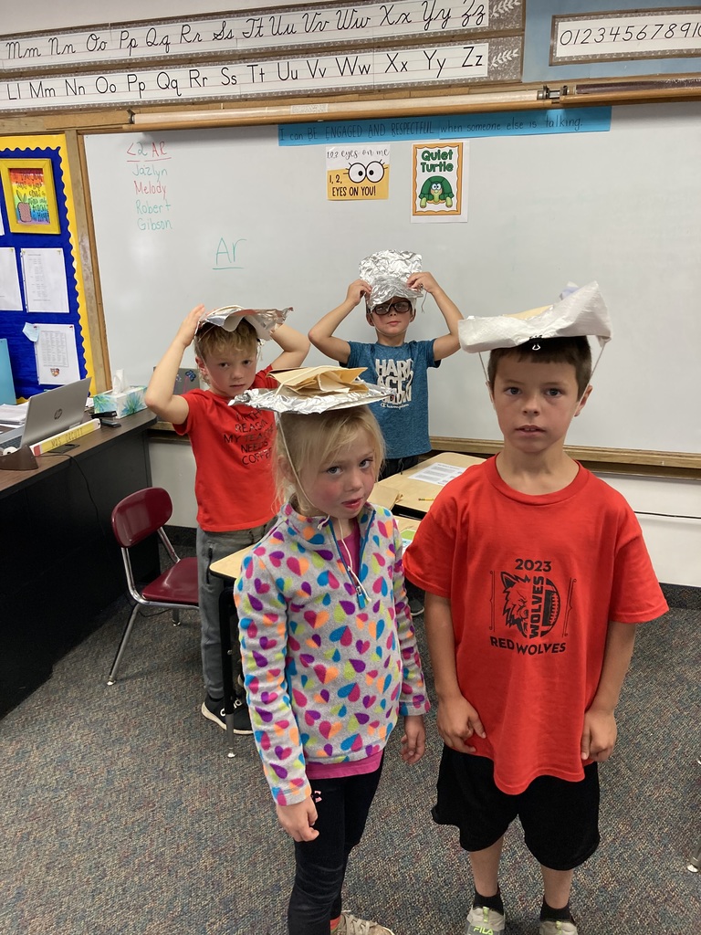 4 students with hats